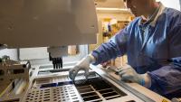 Researcher prepares batch of samples for analysis